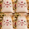 Four cream Christmas sacks showing Arthur, Henry, Aria and Lola with Merry Christmas embroidery