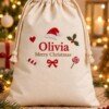 Natural cream drawstring Christmas sack embroidered with Olivia, Merry Christmas and festive motifs