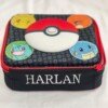 Front and top view of a Pokémon lunch bag with Harlan embroidered in white